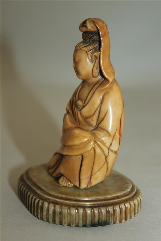 A Chinese soapstone seated figure of Guanyin, 17th / 18th century, 10cm, label for R & V Tregaskis